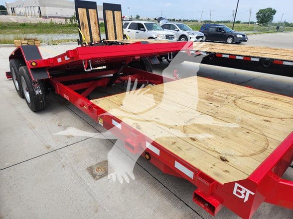 Flatbed trailer with red steel frame and wooden deck. Dual rear axles, black tires, hydraulic gooseneck components, and stakes. Stock number 162502 not visible text.