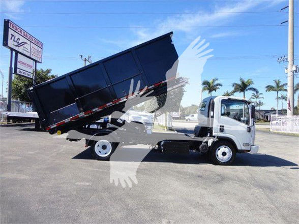 Isuzu NRR truck with dumped black bed, side view showing cab and dump bed raised.