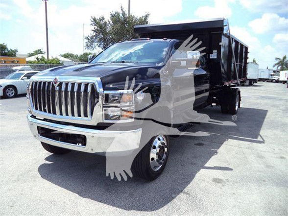 Black 2023 International CV dump truck with a chrome front grille and black dump bed. Visible text includes front grille details and generic vehicle styling; no legible model text or serial numbers readable in image.