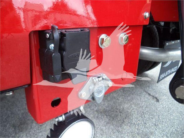 Ram 5500 Tow truck rear corner showing hitch receiver and electrical connector mounting hardware with bolts.
