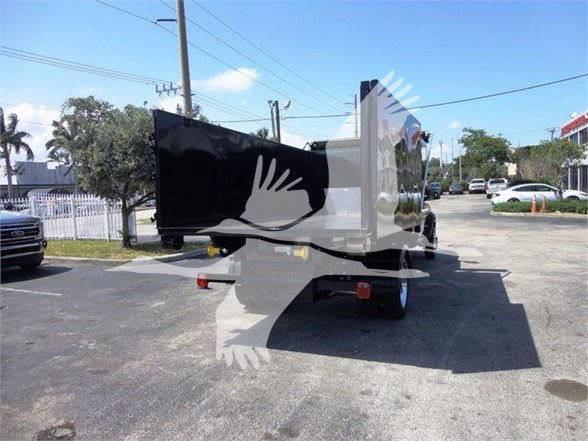 Ram 5500 HD dump truck shown from rear-left side in a parking lot.