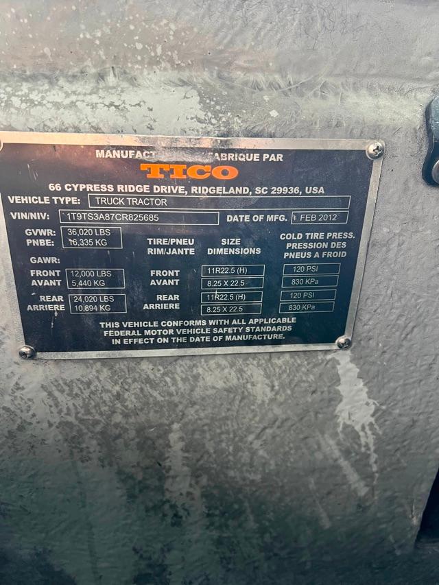 Plate showing manufacturer information for a Tico truck tractor with GVWR 36,020 lbs, front/rear axle specs, tire sizes, and date of manufacture FEB 2012.
