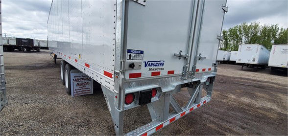 Vanguard MAXCUBE dry van trailer rear showing bumper, taillights, and rear doors with reflective striping.