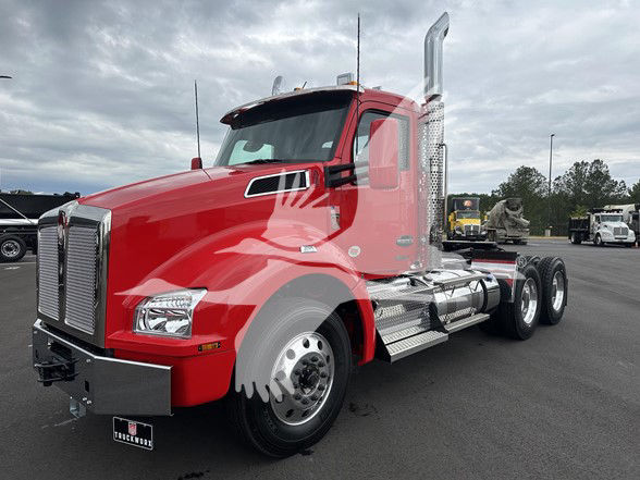 Kenworth T880 conventional daycab truck shown in red with chrome exhaust stacks and dual rear axles.