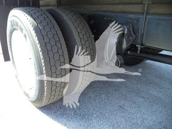 Truck rear dual tires and undercarriage of a 2016 Freightliner Business Class M2 106 reefer truck showing dual rear wheels and suspension components.