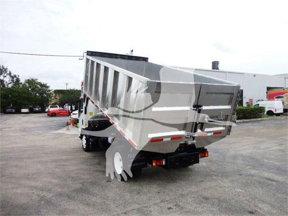 Isuzu NQR dump truck rear and side view showing open dump bed and rear tires.