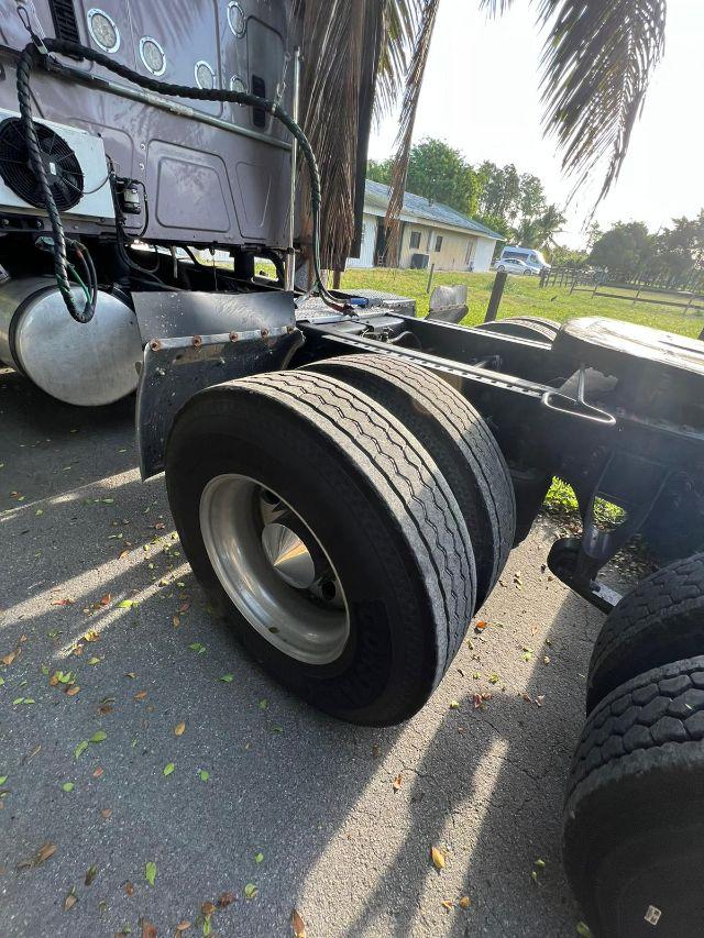 International Prostar truck rear dual tires and chassis showing wheel rims and fuel tank area.