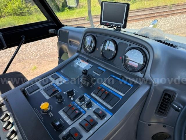Cab interior of 2010 Elgin Pelican NP sweeper showing dashboard with gauges, switches, and a mounted display.