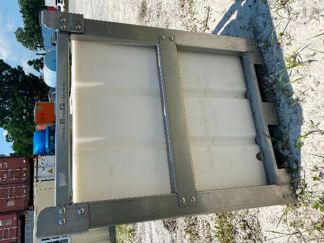 Industrial vapor blaster tank unit with metal frame and white plastic container, mounted on pallet at an outdoor lot.