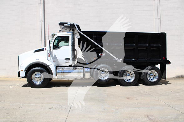 Kenworth T880 dump truck in a side profile view with black dump bed and white cab.