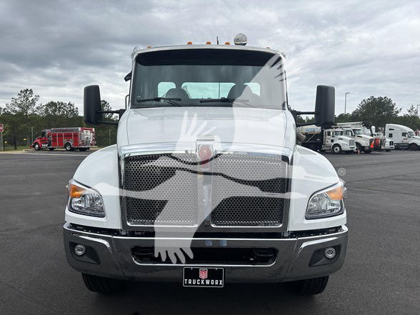 Kenworth T380 cab and chassis front view with grille, headlights, and chrome bumper.