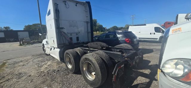 Kenworth T680 rear chassis view showing dual rear axles and fifth wheel mount.
