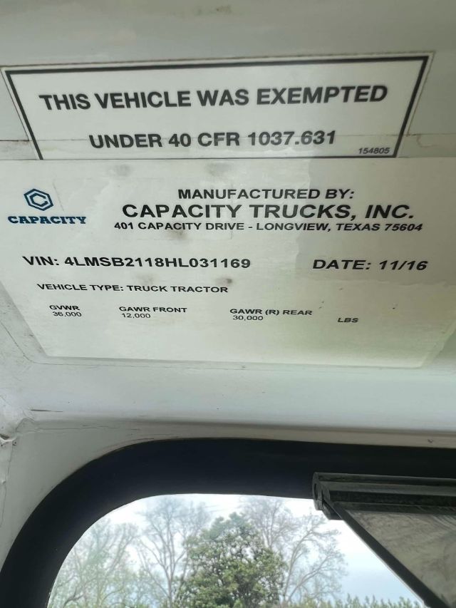 Capacity Trucks label showing VIN, date, GVWR, GAWRs and exempted under 40 CFR 1037.631. Manufactured by Capacity Trucks, Inc., 401 Capacity Drive, Longview, Texas.