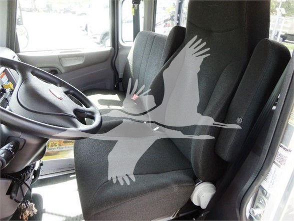 Peterbilt truck cab interior showing driver seat and steering wheel with a watermark graphic overlay.