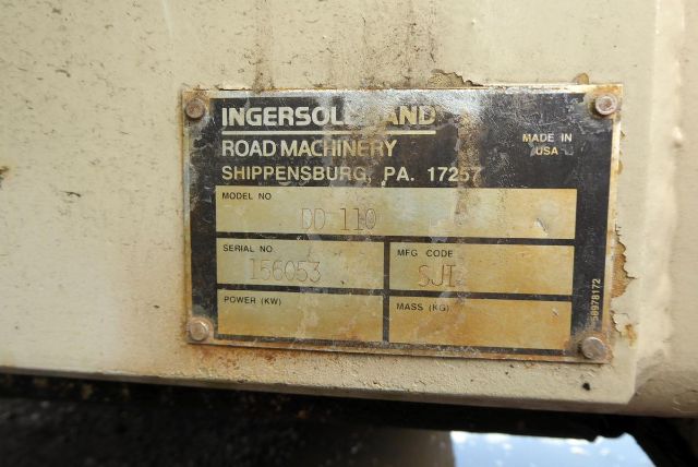 Ingersoll-Rand plate on equipment showing model number DD110, serial number 156053, and MFG code SJT. Made in USA label and power/mass fields visible.