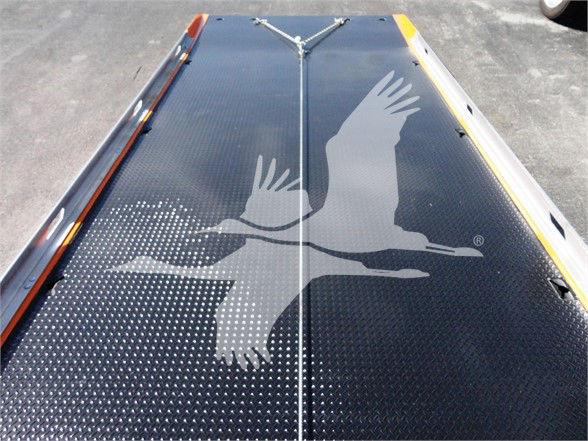 Peterbilt 337 truck showing a black aluminum deck with a large silver bird logo