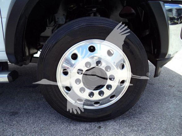 Ram 4500 wheel and chrome hub showing tire and wheel assembly in front fender area.