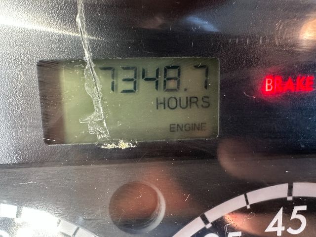 Dashboard display showing 7348.7 hours engine hours; BEAM indicator on; gauge at bottom.