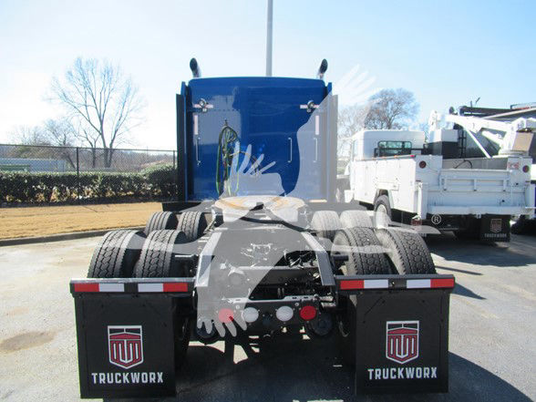 Kenworth W900L rear view showing fifth wheel and dual rear axles with TruckWork mudflaps.
