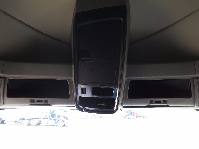 Center console overhead with storage compartments in a 2010 International Prostar cab. No legible serials or fluid labels visible.
