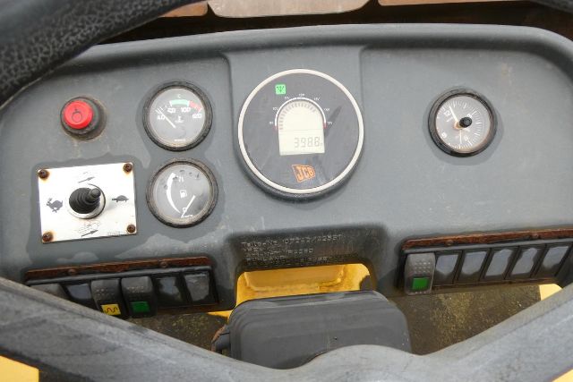 Dashboard of Vibromax VM106D showing gauge cluster and control switches.