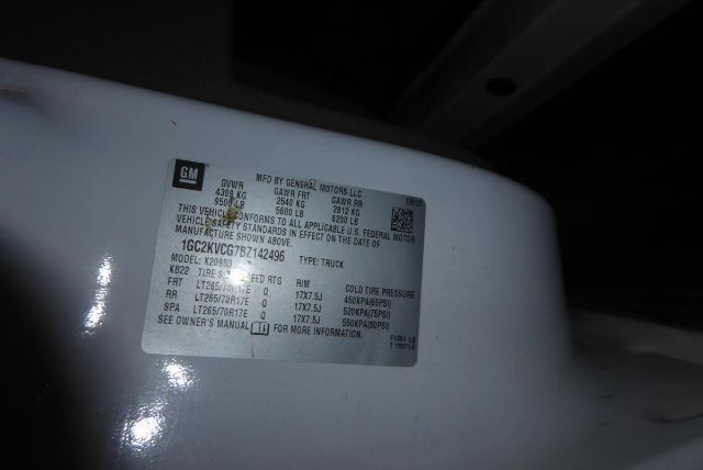 GM VIN sticker on Chevrolet 2500HD truck showing GVWR, GAWR, tire size, and vehicle identification details.