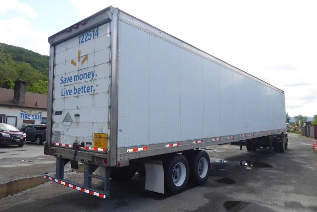 Great Dane trailer with white exterior showing rear doors and dual rear axles.
