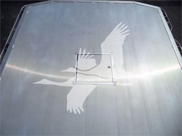 Truck bed with diamond plate surface and a large white graphic of a leaping figure on the overhead, hatch in center of bed ceiling.