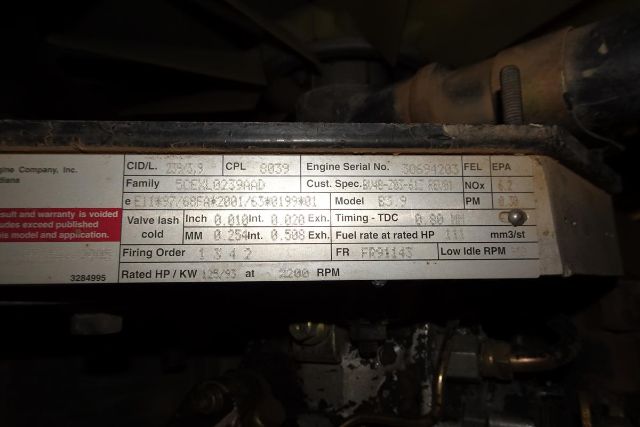 Engine data plate on Vibromax VM106D with model, serial, and various specs and warnings. Includes VIN related fields and engine numbers.