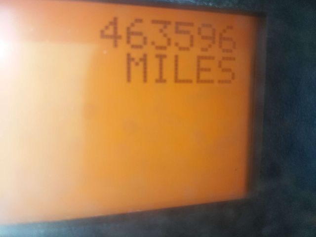 Instrument display showing mileage 463596 MILES in an orange monochrome LCD readout.