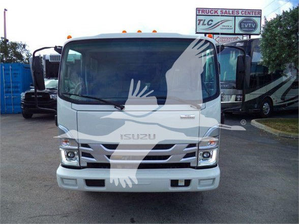 Isuzu NPR HD truck front view with large windshield, Isuzu logo on grille, stock info overlay not visible in text; generic dealership lot in background.