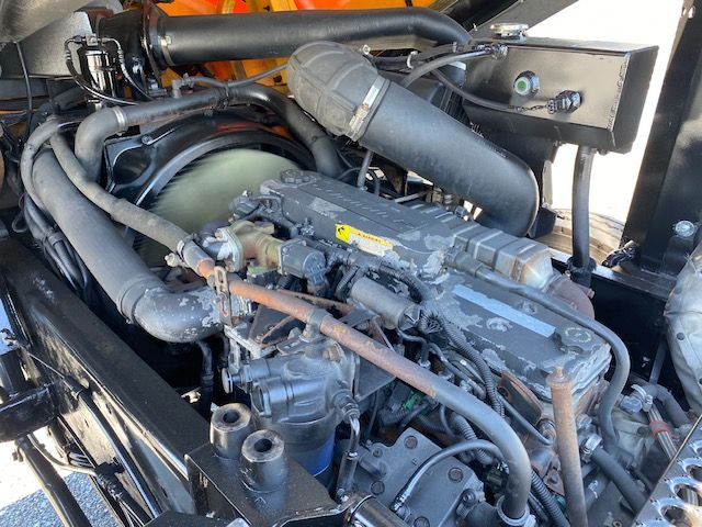 Ottawa T2 engine bay showing diesel engine with hoses, turbocharger, and intake piping.