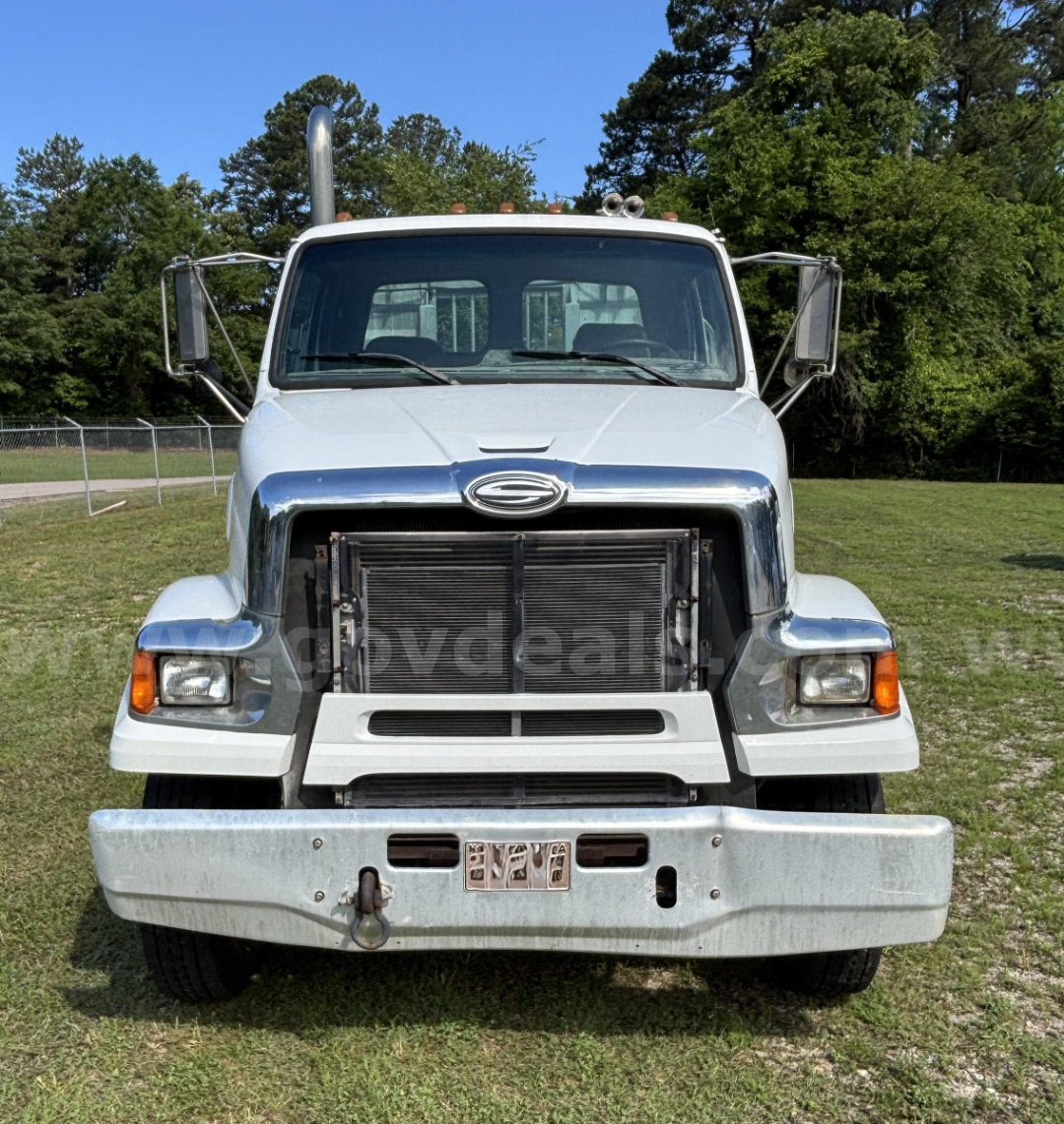 Front view of a white 2009 Sterling LT9500 cab and chassis truck with large chrome grille, bumper, and dual side mirrors.