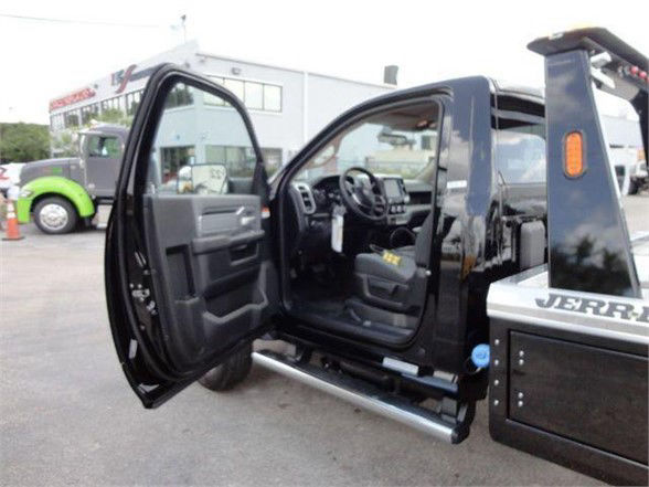 2024 Ram 4500 HD SLT side interior showing open front doors and steps.