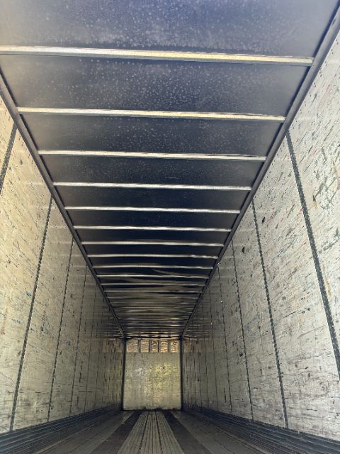 Interior of a 2004 Wabash van trailer showing empty cargo area with vertical ribs and floor panels.