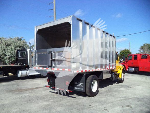 2019 International DURASTAR 4300 truck with dump body in a lot.