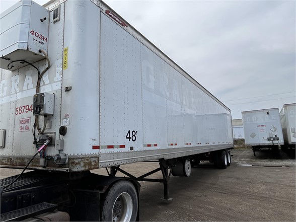 Great Dane 2015 dry van trailer side view showing 48' length and rear area with branding. Visible labels include 587944 stock number on front left and height markings on the nose.
