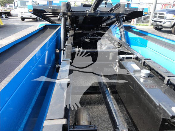 Peterbilt 337 truck bed showing metal framework and blue side walls.