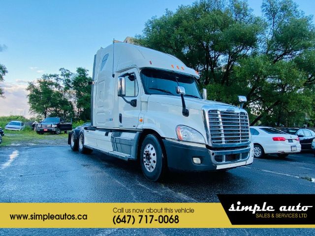 Freightliner Cascadia truck in a parking lot with a yellow banner at the bottom showing Simple Auto dealership information.