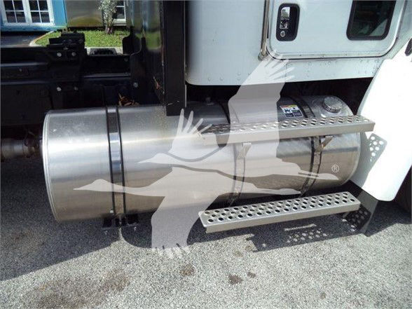Side view of a Kenworth T370 pickup with a cylindrical fuel tank and metal step rails. Visible text on the image is not legible.