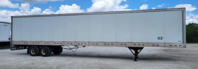 Trailer side view showing 53' Vanguard VXP utility trailer with triple axle and landing gear.