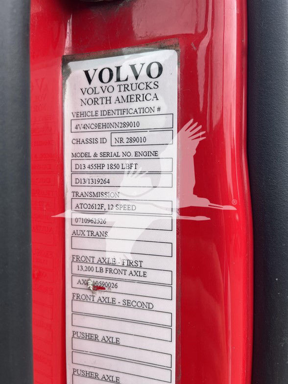 Volvo Trucks North America vehicle identification label with chassis ID, model, engine, transmission details and front axle ratings.