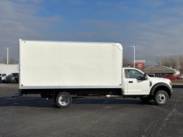 Ford F-550 box truck side view showing large cargo box and white cab.