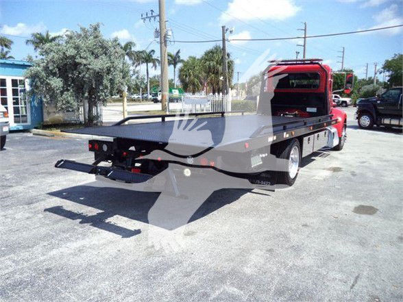 Peterbilt 337 tow truck rear view showing flatbed and cab, stock number T21864.