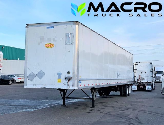 2017 Stoughton dry van trailer in a parking lot with MACRO TRUCK SALES watermark; front and side view showing landing gear, nose box, and rear doors