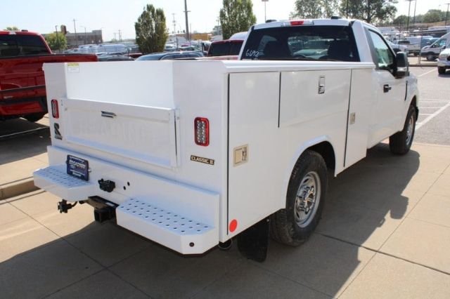 Ford F-250 service body back and side view showing utility compartments and spare tire.
