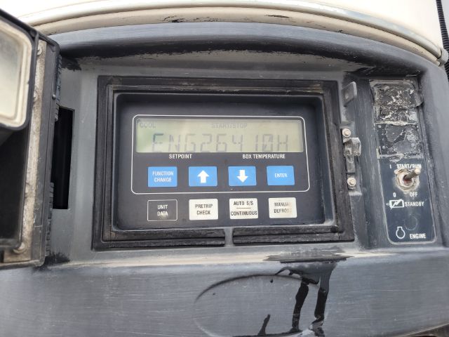 Instrument panel of a refrigeration trailer controller with blue and white keypad, showing numeric display. Labels include SETPOINT, BOX TEMPERATURE, FUNCTION CHANGE, PRETRIP CHECK, AUTO SYS CONTINUOUS, MANUAL DEFROST.