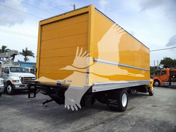 Box truck rear/side view showing a yellow cargo box with metal trim and a black chassis. No visible branding or text on the truck exterior.