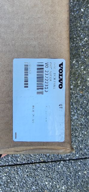Volvo tag on brown box showing barcode label and serial numbers.