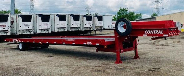 Red drop-deck container delivery trailer with single axle and front-mounted hitch, labeled CONTRAL, parked on gravel.